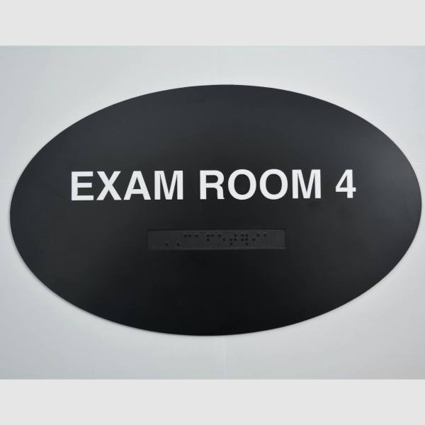 Exam Room 4 black oval braille sign