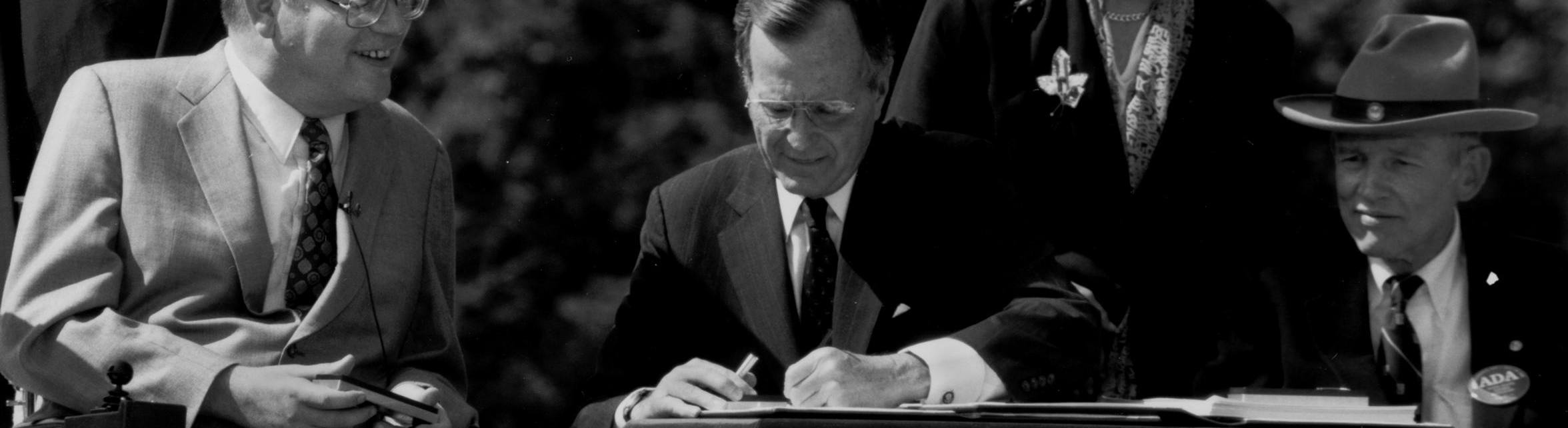 President George H. W. Bush signs the ADA into law 1990